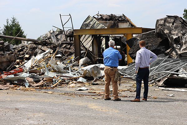 An associate from the Glatfelter Claims team looks over damage to a municipal building.