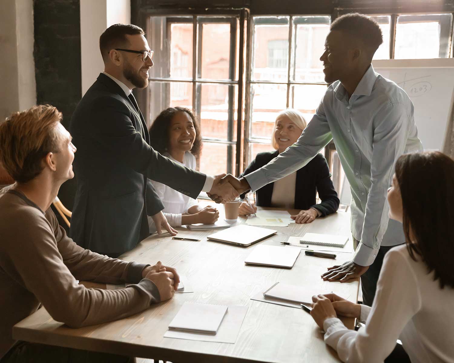 People shaking hands in a business meeting