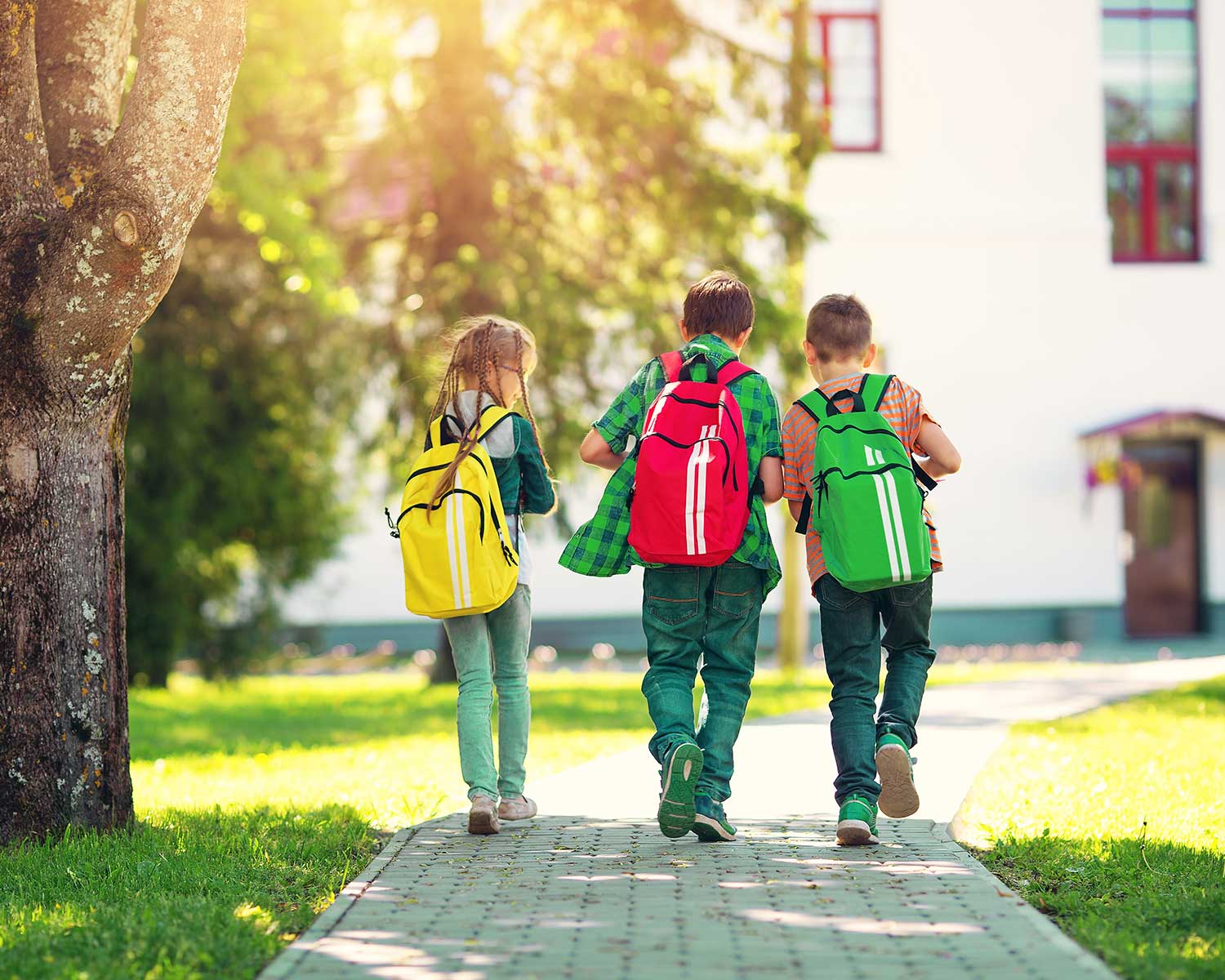 Kids walking with backpacks on