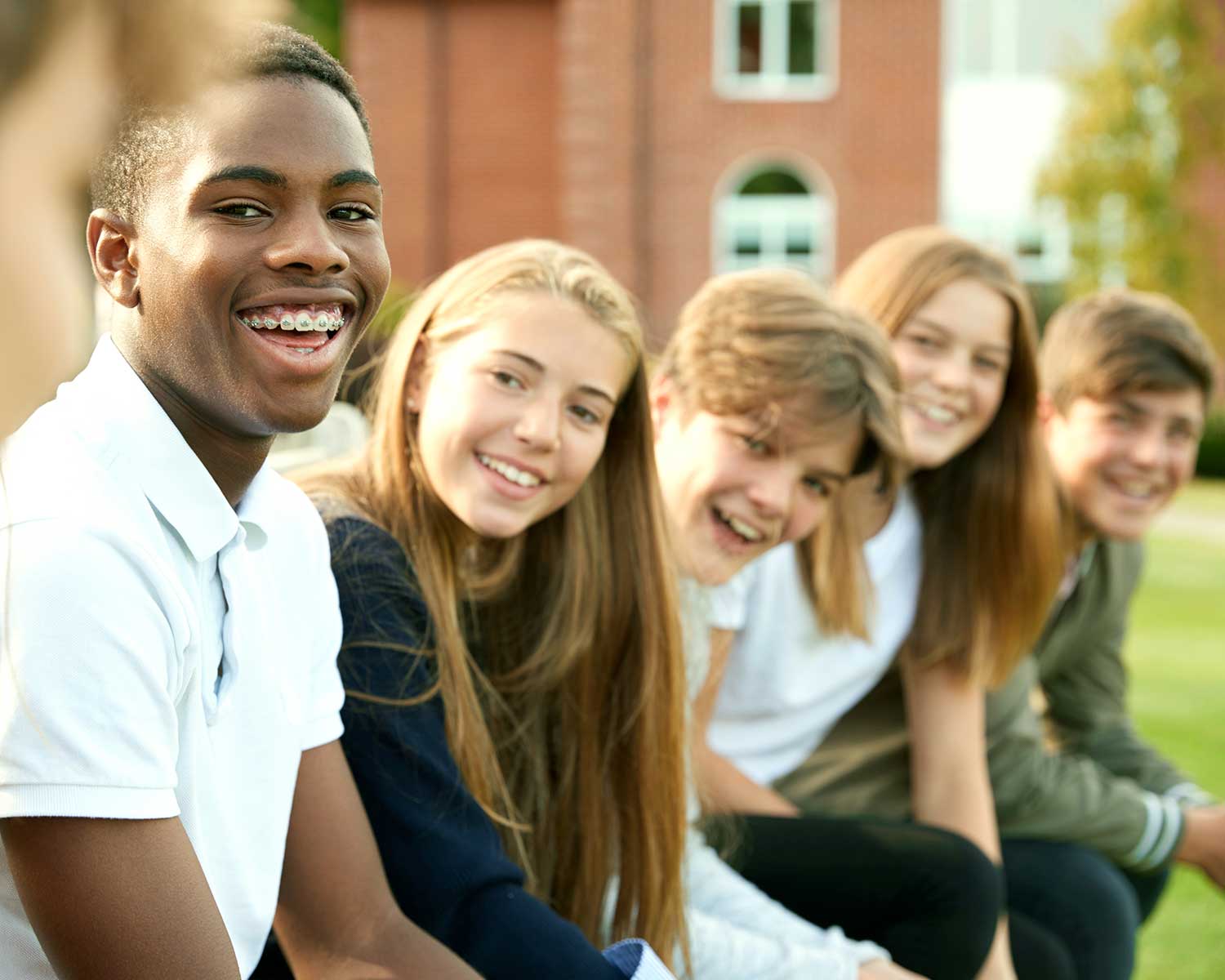 Kids sitting and smiling